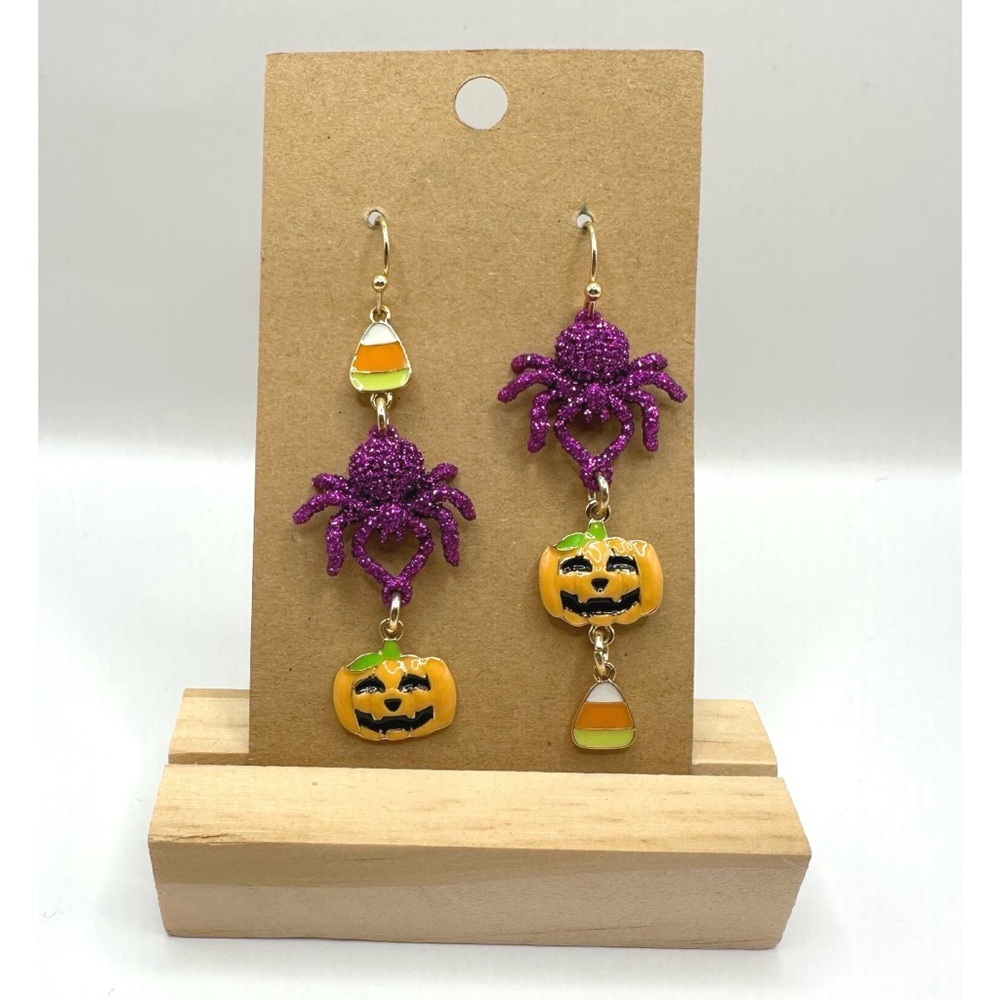 Halloween purple glitter spider, an orange jack-o'-lantern,candy corn earrings